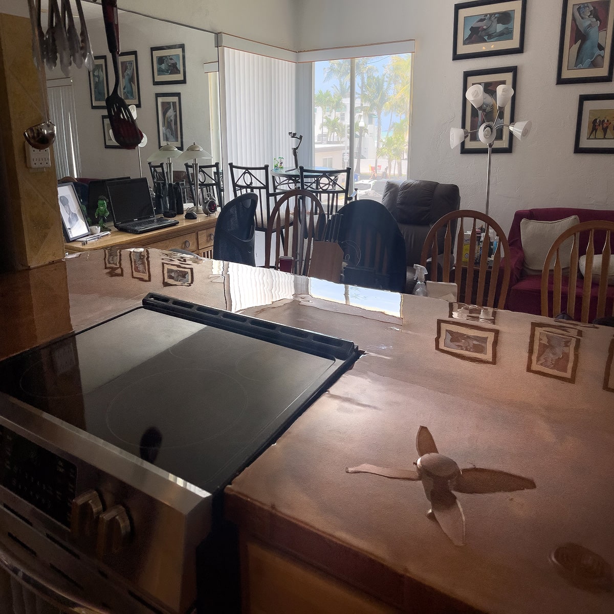 An epoxy resin redesign of a residential home kitchen space, with epoxy countertops.