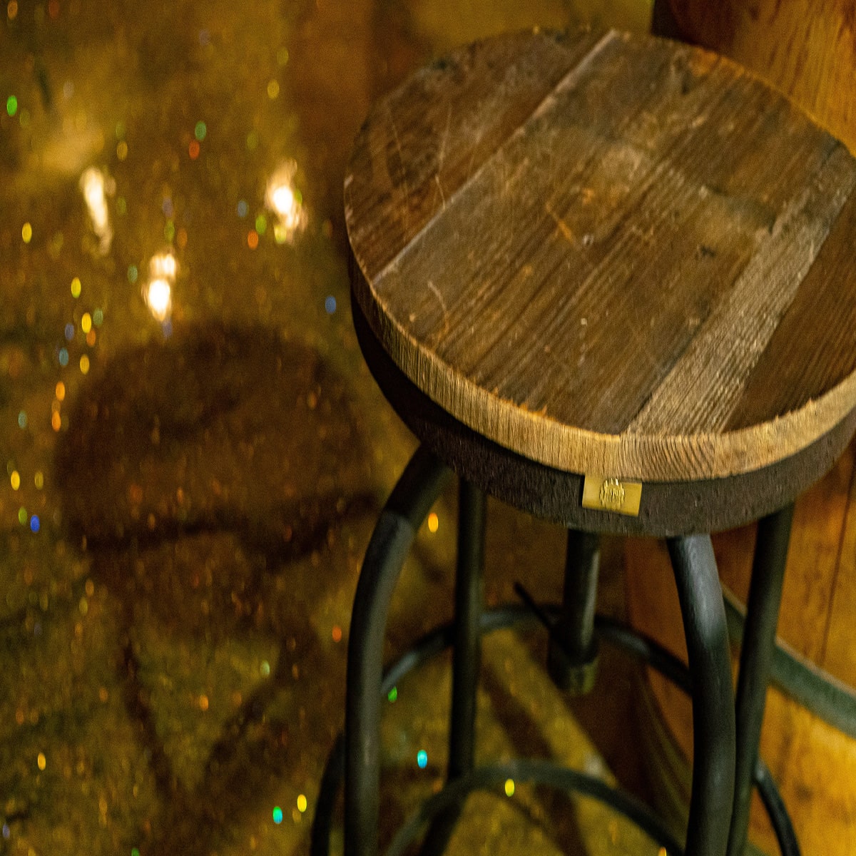 Glittery gold epoxy resin installed in a bar room floor.