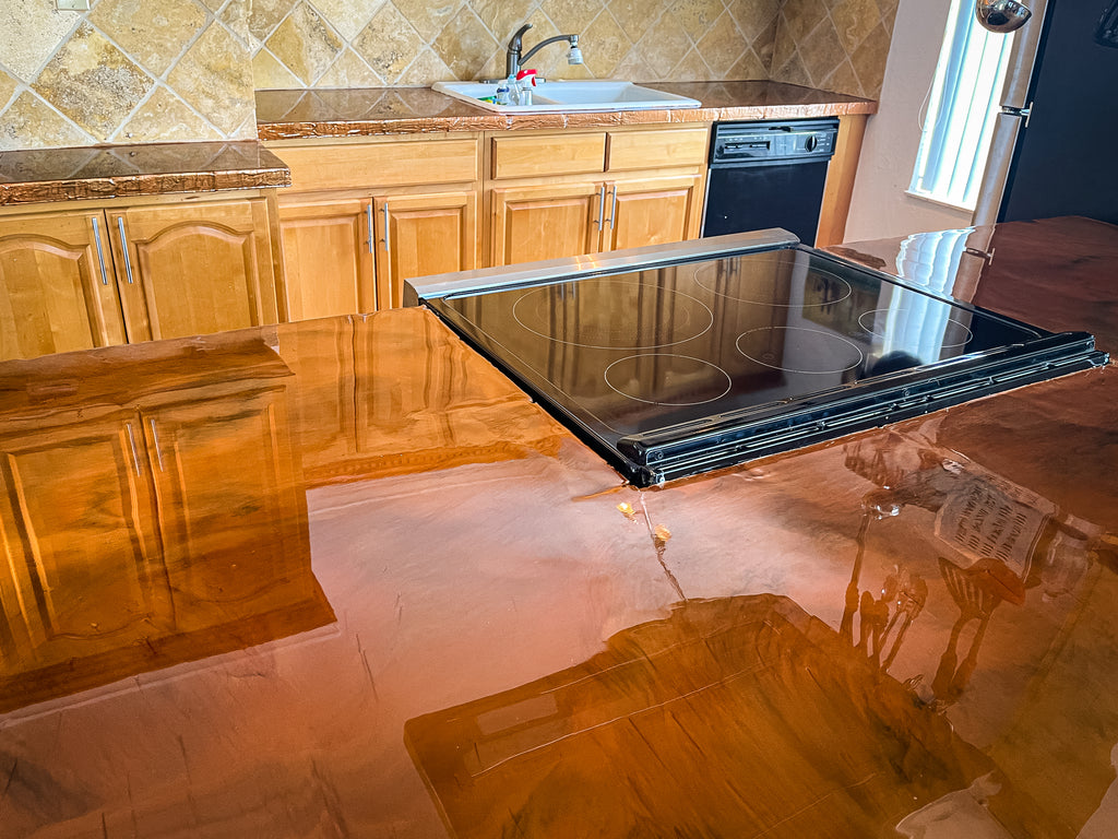 Epoxy resin countertops perfectly mimicking a stone countertop finish in a homeowner's countertop and kitchen renovation.