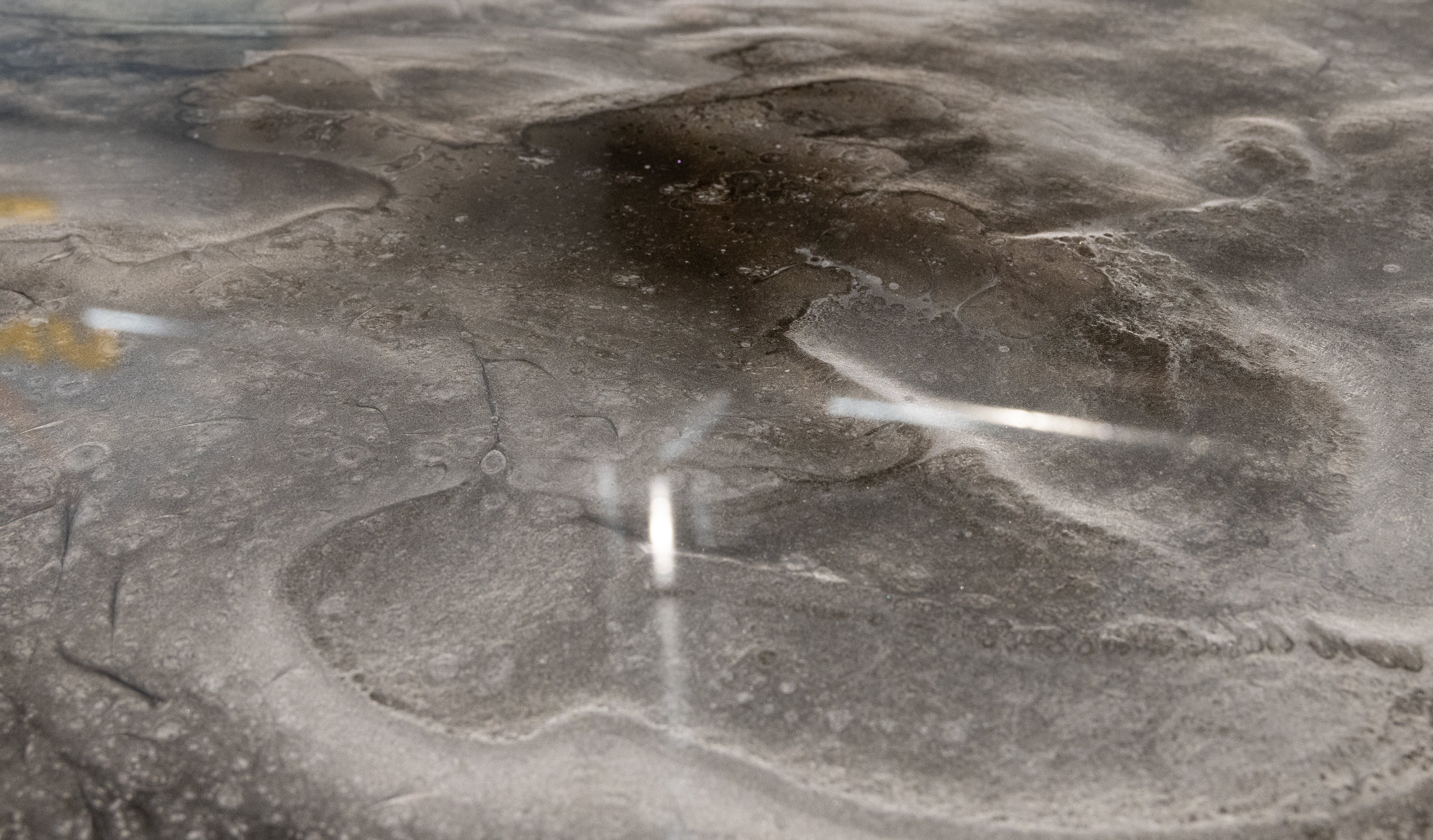 Metallic design epoxy resin installed on a concrete flooring foundation.