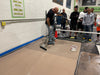 An epoxy resin contractor teaching student contractors how to install garage floor epoxy flake systems.