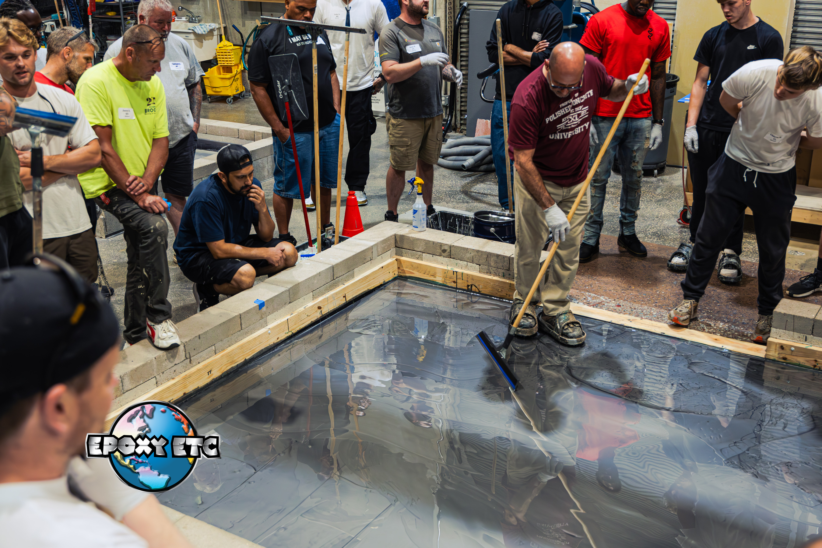 An epoxy resin flooring training course showing how to install a metallic epoxy resin flooring system.
