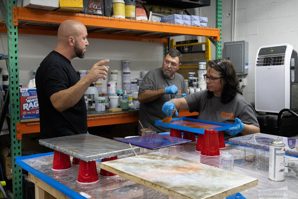 Contractors-in-training learn how to install different epoxy resin designs and styles.